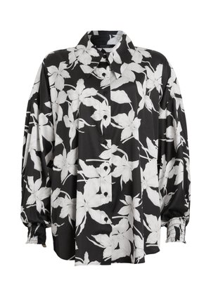 Camicia a bottoni floreale in bianco e nero con colletto a punta, maniche arricciate e tessuto morbido. Presenta grandi motivi floreali.