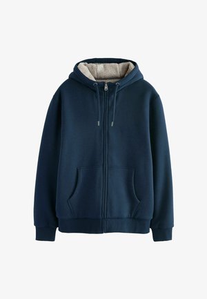 Granatowa bluza z kapturem na zamek z miękką beżową polarową podszewką, z regulowanym kapturem, dwoma przednimi kieszeniami, prążkowanymi mankietami i dolnym obszyciem. Gładka zewnętrzna faktura.