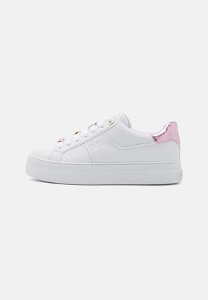 White low-top sneaker with embossed pattern, gold eyelets, white laces, thick sole, and metallic pink heel tab.