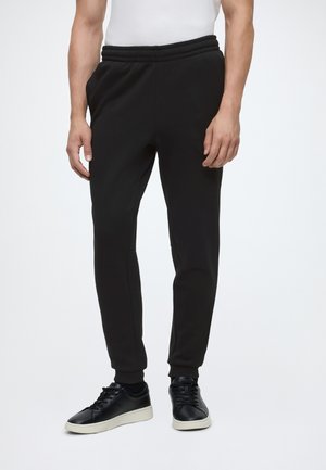 Lacoste UNISEX - Pantalon de survêtement - black