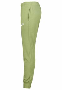 Ljusgröna sweatpants med elastisk midja, sidofickor och en vit Nike-logga placerad på vänster lår. Slät bomullstyg.