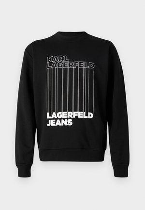 Fekete pulóver fehér függőleges csíkokkal és vastag betűkkel, amelyeken a "KARL LAGERFELD" és a "LAGERFELD JEANS" felirat szerepel. Klasszikus kerek nyakú dizájn.