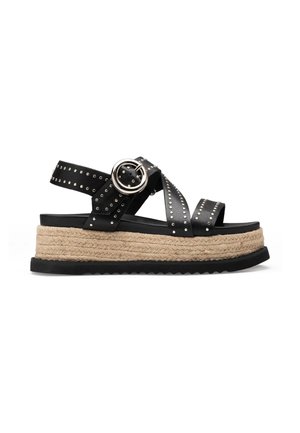 Sandalo platform nero con borchie argento, grande fibbia rotonda, intersuola in corda intrecciata e suola esterna in gomma nera scanalata.