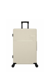 Harde koffer in beige met verticale groeven, uitschuifbare zwarte handgreep en vier zwarte wielen voor gemakkelijke mobiliteit.