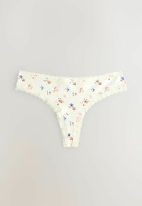 Chiloti tanga de culoare crem, cu dantelă la margini, având modele mici florale și fundițe albastre, roz și roșii pe un fundal deschis.