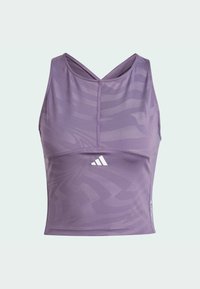Limitless crop top i lys lilla med et diskret mønster, der har en scoop neckline og krydsede stropper, lavet af strækbart syntetisk materiale.