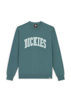 Sudadera de algodón en color teal con "DICKIES" en texto curvado blanco en el pecho. Puños y dobladillo acanalados, con una pequeña etiqueta del logo en la cintura.