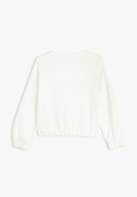 Hvid, cropped sweatshirt med raglanærmer og elastiske manchetter. Blød tekstur, minimalistisk design, ingen synlige mønstre eller hardware.