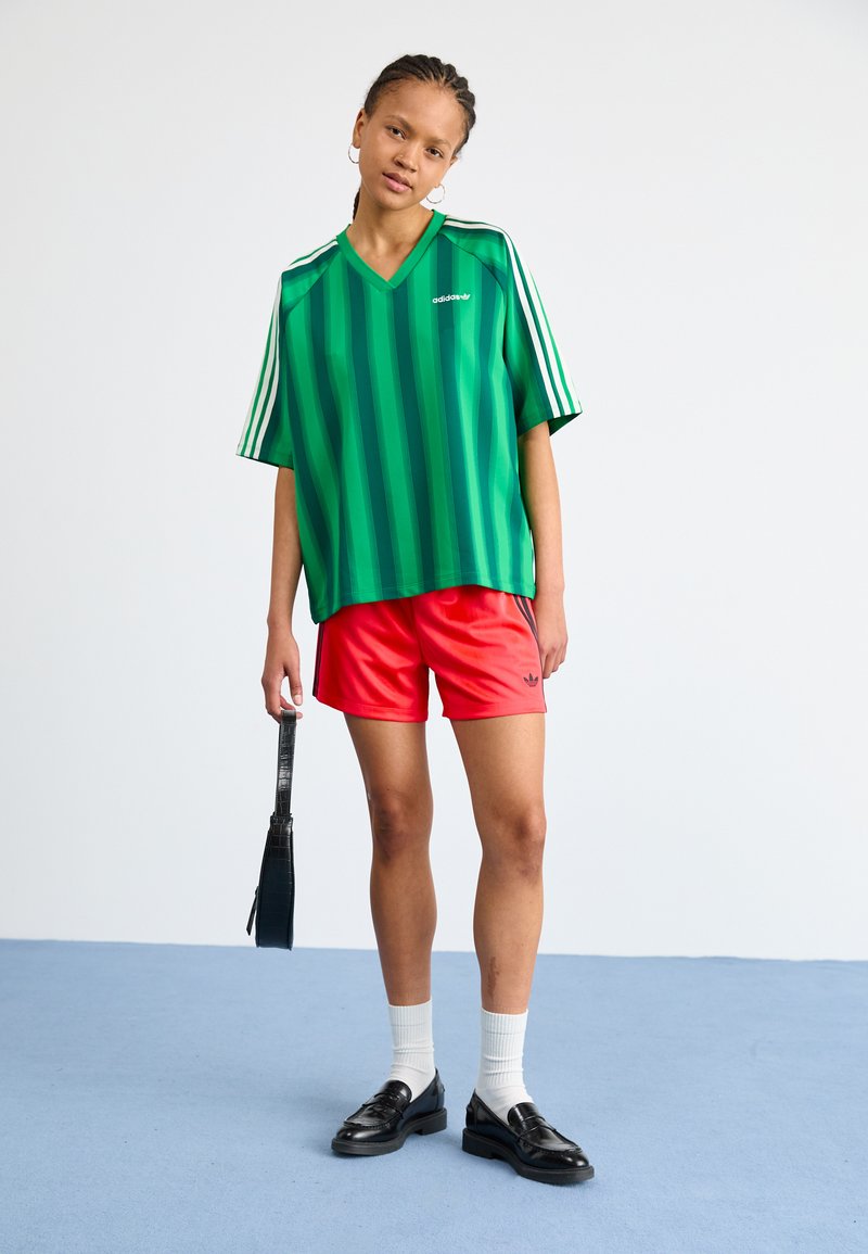 adidas Originals Teplákové kalhoty - lucid red/black