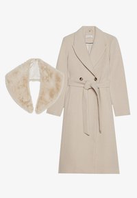 Beige wool coat with double-breasted design, belt, and large lapels; paired with a soft, faux fur collar in a matching shade.