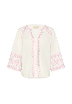 Blusa blanca con intrincados bordados en rosa a lo largo del escote y las mangas. El diseño incluye patrones geométricos y botones en la parte frontal.