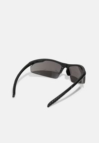 Black sports sunglasses with wraparound design, dark tinted lenses, textured black arm grips, and subtle ventilation openings.