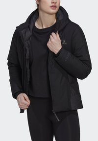 Black puffer jacket with a hood, featuring a zippered front, textured fabric, and "GOLD.RDY" printed detail on the sleeve.