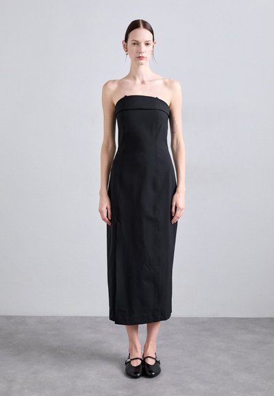 Black strapless midi dress with a fitted bodice and a straight silhouette. Made of smooth fabric, features discreet seams and no visible patterns.