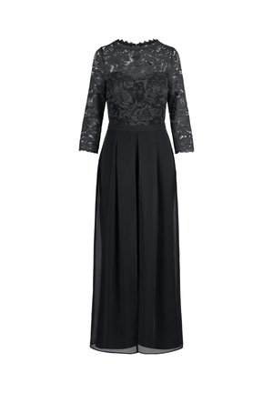 Vestido negro con corsé de encaje y mangas tres cuartos. Presenta una falda plisada y un sobrecuerpo transparente, con un detalle de escote con forma de ondas.