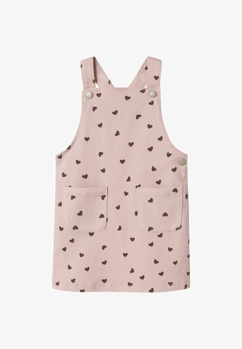 Heledane roosa puuvillane kombinesoon, millel on väikesed pruunid südamemustrid, reguleeritavad õlapaelad ja kaks esikotid.