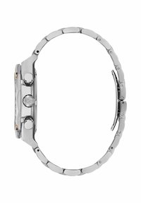 Hõbedane roostevabast terasest kell ümmarguse korpusega, nähtavate nupudega ja linkidest koosneva käevõruga, millel on harjatud ja poleeritud viimistlus.