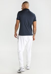 Fila STRIPES - Polo - peacoat blue/white