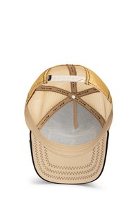 Gorra de malla beige con un panel frontal estructurado, visera negra en contraste y costuras en zigzag a lo largo del borde. Correa de plástico ajustable en la parte posterior.