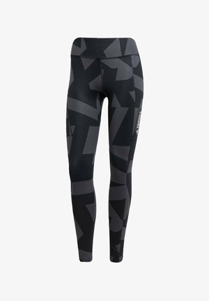 Leggings neri e grigi con motivo, dotati di un alto elastico in vita e tasca laterale, realizzati in un materiale elastico e traspirante con un design elegante.