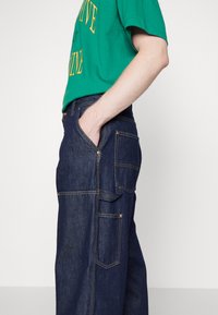 Carhartt WIP NASH PANT SMITH - Relaxed fit -farkut - blue rinsed