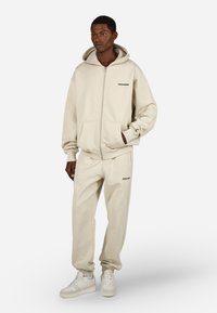 Pegador LOGO WIDE  - Tepláky - washed cozy beige black