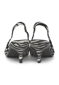 Zeppe a slingback con motivo zebro da donna, realizzate in tessuto testurizzato, punta affusolata e tacco a stiletto di 5 cm in una combinazione di colori nero e crema.