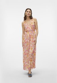 Floral maxi dress with a v-neck, thin straps, and elastic waist. Colors include pink, orange, and yellow flowers on a light background.