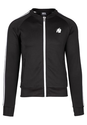 Black zip-up jacket made of smooth fabric. Features white stripes along the shoulders and a small logo on the chest. Front pockets included.