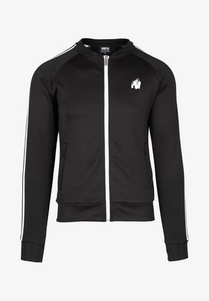 Black zip-up jacket made of smooth fabric. Features white stripes along the shoulders and a small logo on the chest. Front pockets included.