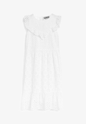 Vestido midi blanco sin mangas con recortes florales calados, cuello y bajo con volantes, y cierre con botones en la espalda.
