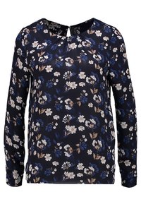 Blusa floreale con maniche lunghe, sfondo blu navy, con fiori bianchi e blu, scollatura rotonda con un piccolo dettaglio a chiave sul retro.