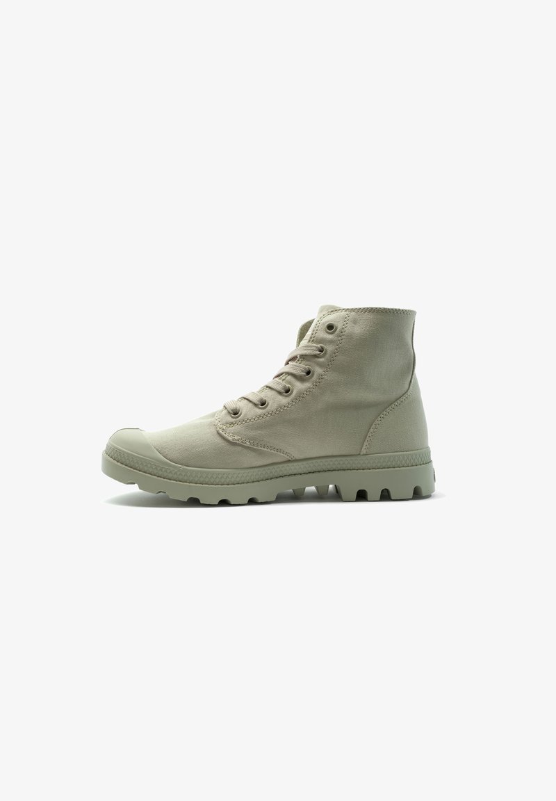 Light green high-top sneakers made of canvas, featuring rounded toe, six eyelets, and a textured rubber sole with deep traction lugs.