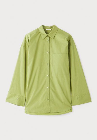 Light green button-up shirt with long sleeves, a classic collar, a chest pocket, and a smooth, textured fabric.