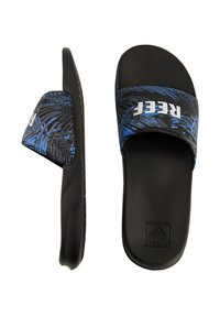 Black slide sandals with a blue and black palm leaf pattern on the strap. Rubber sole with textured grip and logo detailing.