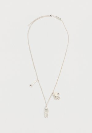 Silver chain necklace with three charms: a hand, a mobile phone, and a microphone, displayed on a white background.