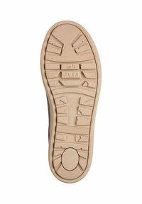 La semelle de chaussure est en caoutchouc beige avec des motifs de traction texturés, comprenant "soft" et "FLEX" moulés dans le design.