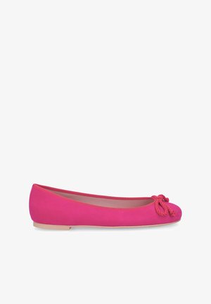Bright pink suede ballet flat with a small bow detail on the toe and beige flat sole.