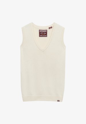 Cremefarvet ærmeløs sweater med V-hals, ribbede kanter og et lille mærke i bunden til venstre. Blød striktextur.