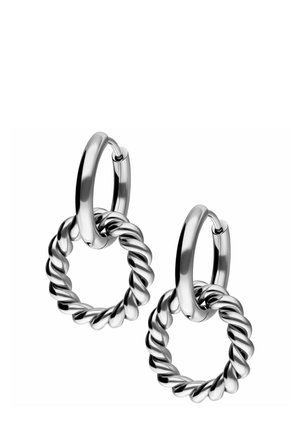 Silver metal hoop earrings feature a twisted circular design attached to a smooth hoop. The finish is shiny with a reflective surface.