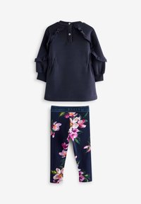 Mornarska obleka s sweatshirt krojem in volanastimi detajli ter gumbi; v kombinaciji s temno barvnimi leginami s cvetličnim vzorcem. Raztegljiv, mehak material.