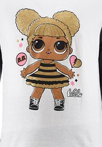 Cartoon character with golden hair in two puffs, wears a black and gold striped dress, black shoes, and has large eyes. Features a pink bubble.