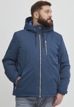 Navy blue padded jacket with a hood, featuring a zippered front and pockets, adjustable drawstrings, and a smooth, durable texture.