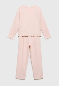 Ribbed fabric pajama set in soft pink, featuring a long-sleeve top and elastic waist pants. Simple, relaxed design with straight leg cut.