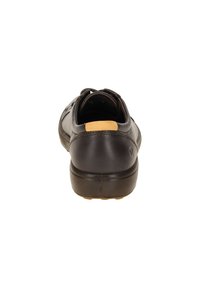 Scarpa casual in pelle marrone con forma arrotondata, superficie testurizzata e suola in gomma con un accento giallo sul tallone.