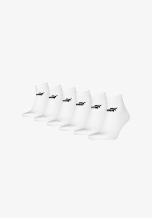 White ankle socks, six-pack, featuring a reinforced cuff and heel, with a black logo detail. Smooth texture, cotton blend material.