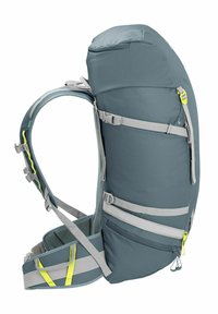 Zaino con parte superiore arrotondata, realizzato in tessuto grigio, con dettagli gialli, spallacci regolabili e numerose tasche laterali per lo stoccaggio.