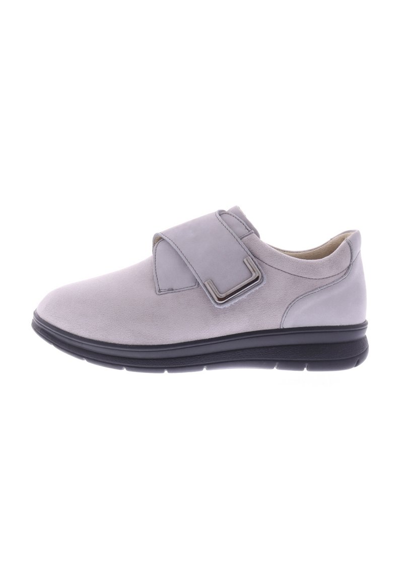 Grey suede shoe with a wide Velcro strap, round toe, cushioned sole, and subtle stitching detail. Smooth leather accents at the heel.