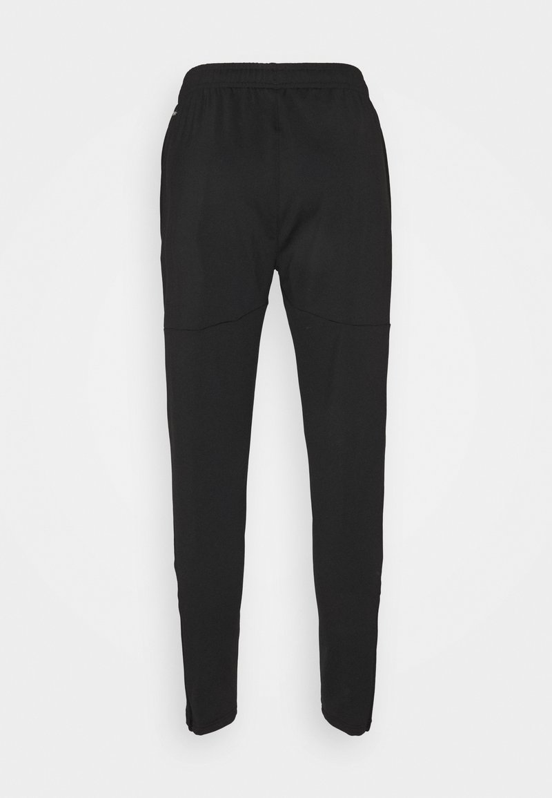 Puma TEAMLIGA TRAINING PANTS PRO - Teplákové kalhoty - black/white