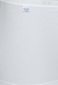 White cotton tank top featuring a smooth texture, fitted design, and a small blue "sloggi" label stitched on the side.